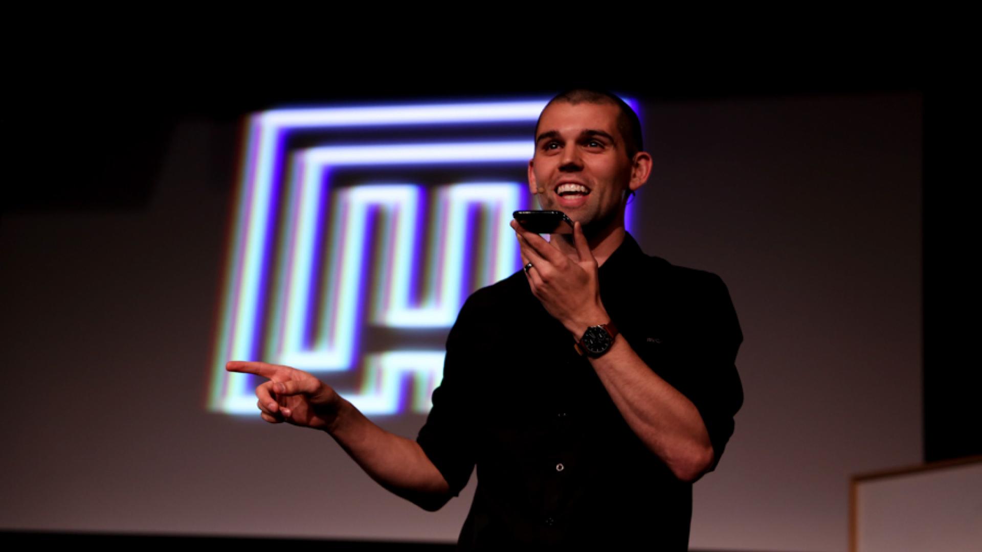 Brice on stage with phone