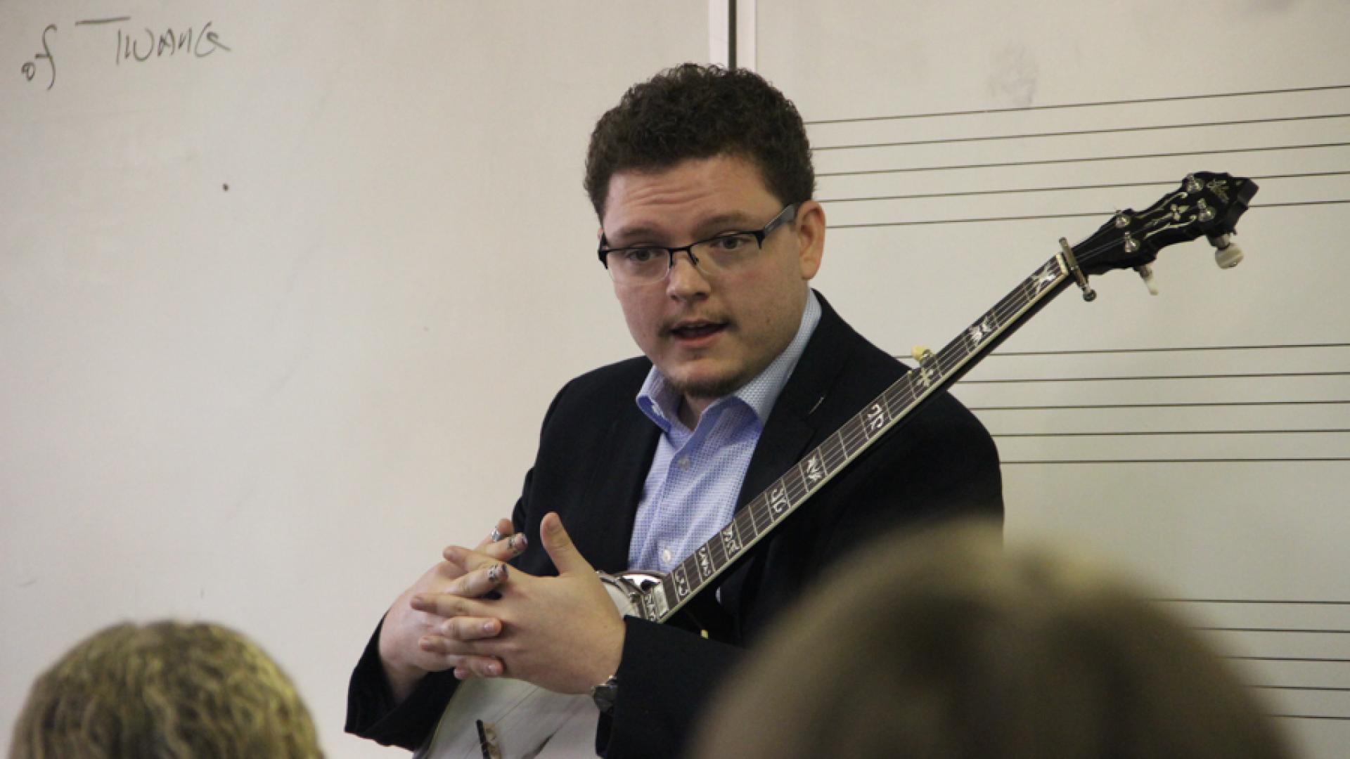 Daxson Lewis talking to students