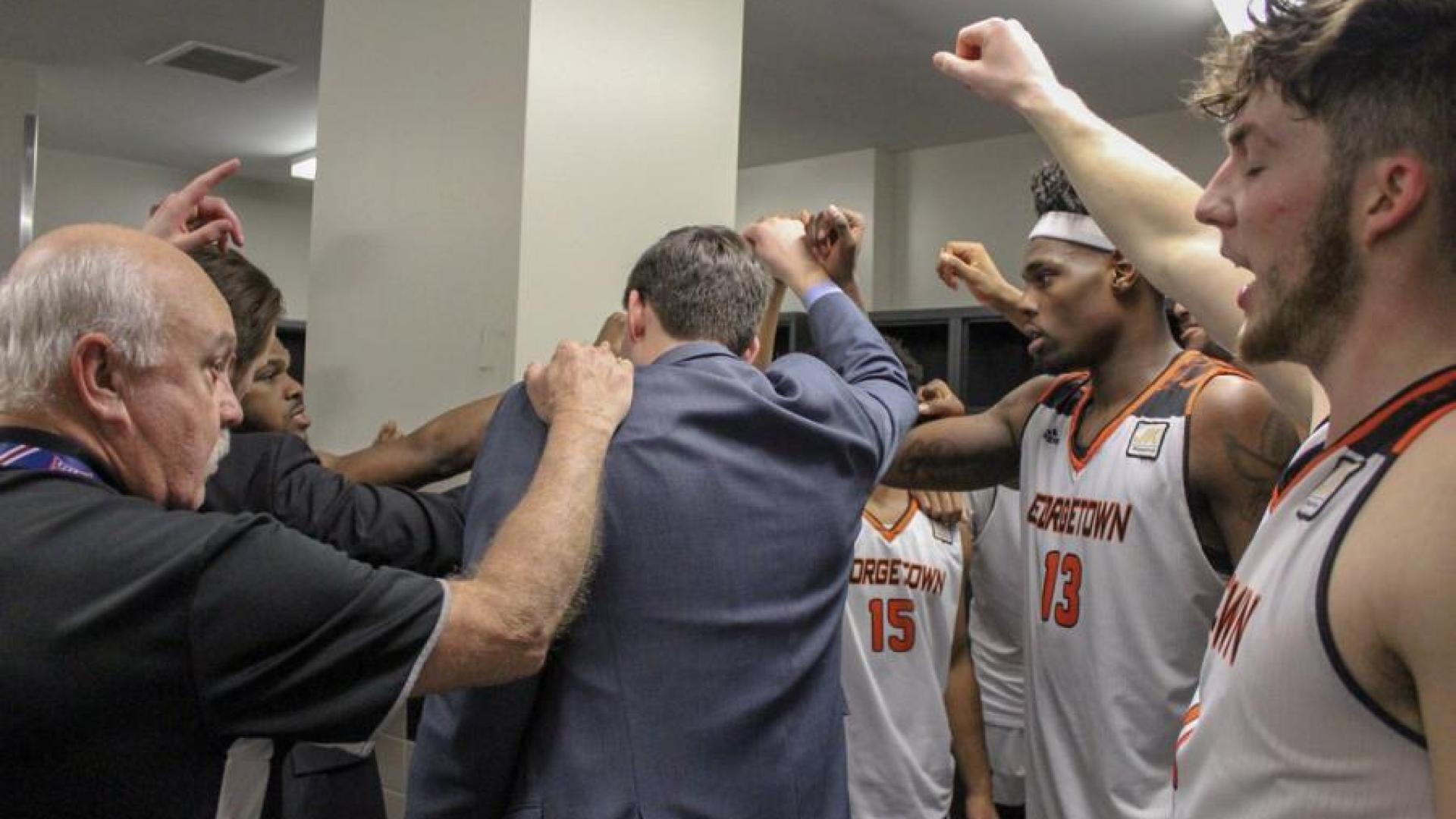 Men's basketball team celebrating