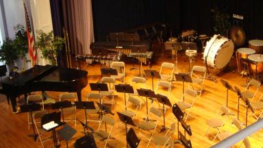 Image: Symphonic Band setup on stage of Hill Chapel
