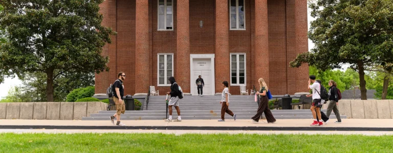 Students walking in front of Giddings Hall.