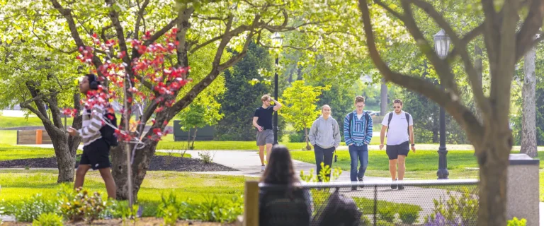 Students walking in front of Giddings Hall.