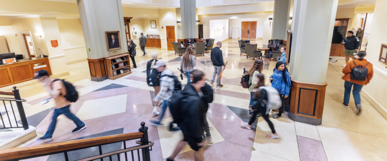 Students walking through the lobby of the Ensor Learning Resource Center.